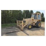 John Deere 210C with Forks