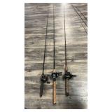 Three fishing poles, with reels, including DAIWA