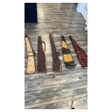 Five leather gun cases