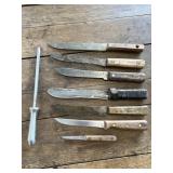 (7) Kitchen/Butcher Knives and a SS Sharpener