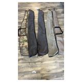 Five gun cases approximately 54 inches long