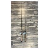 Two fishing poles with reels one Abu Garcia Pro