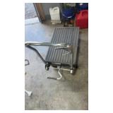 Rolling hydraulic jack by hole master table cart