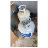 Two propane tanks one is empty. The other one