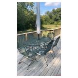 Iron patio table with six chairs and umbrella
