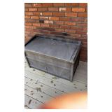 Plastic bench, full of firewood