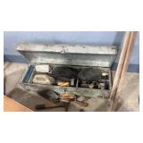Primitive wooden tool chest with several concrete