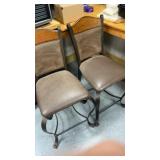 Pair of iron chairs with vinyl tops