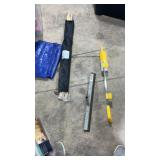 Utility marker, squeegee, tarp and bonfire