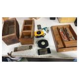 Wooden trays tape measures razor blades, plum Bob