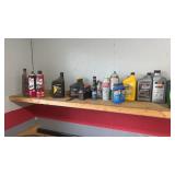 Large assortment of motor oil, parts, cleaner,