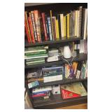 Four shelves of books, including do-it-yourself