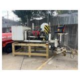 Striping machine with 20 HP Honda engine.