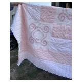 Pink/peach colored handmade quilt, size twin/full