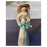 Corn husk doll with a music box. Plays a