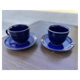 Two Blue Fiesta-ware coffee cups and saucers