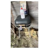 Charcoal grill with charcoal and lighter fluid