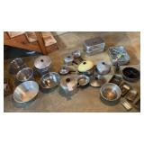 Several aluminum and stainless steel pots and