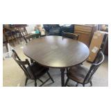Oval table and four wooden chairs
