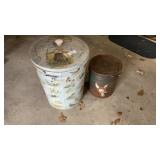 Metal cans. One with birds and one with cartoon