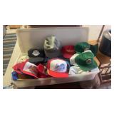 Plastic tote full of vintage ball caps, tall boys