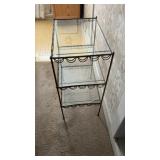 Glass and brass shelf. Bottom shelf has chipped