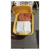 Vinyl tote full of bed linens