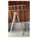 Two aluminum ladders. One wooden stepstool. One