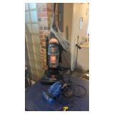 2 vacuums, including Bissell, power force, and a