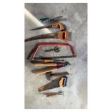 Tool lot. Including saws, snips, and hammer.