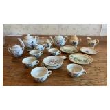 Cartoon tea set. Including Mickey Mouse and