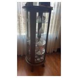 Round curio cabinet with glass shelves