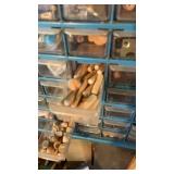 Wall organizer full of wooden dowels