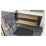 Wooden bench with metal plant holder