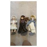 Three porcelain face dolls