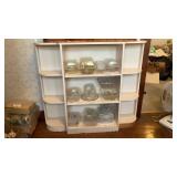 White wooden shelf. Does not contain contents