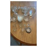 Glass room include candle holders, ball, dishes,