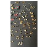 Large lot of earrings and a Nashville Tennessee
