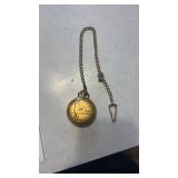 17 jewel pocket watch with fisherman on the front
