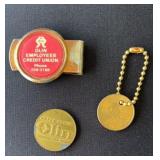 Olin collectibles, including coin, keychain,