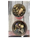 Two cans of brass fittings