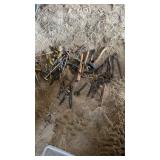 Bucket of handfuls, including hatchets, hammers,