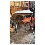 Two iron base stands and metal can