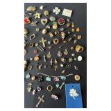 Large lot of jewelry pins and pendants, a few