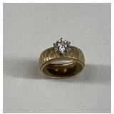 14 karat diamond Solitaire on wide decorative