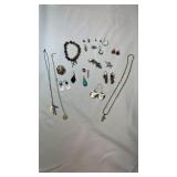 Large lot of costume jewelry earrings, brooch,