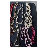 Large lot of necklaces, costume jewelry, shell