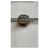 Four row yellow gold, turquoise and white stones