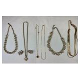 (6) Gold tone necklaces and one matching earrings