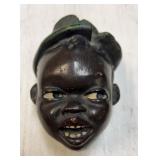 Vintage black Americana plaster wall face with